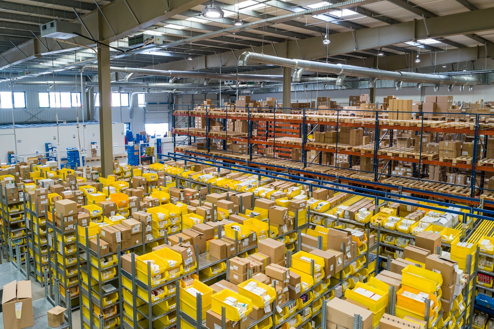 Forklift operator moving goods in a logistics centre